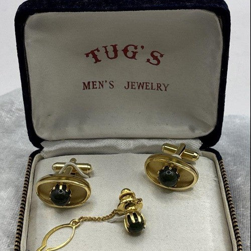 Gold-tone cufflinks and tie tack with green cabochons in a Tug's presentation box, view 2