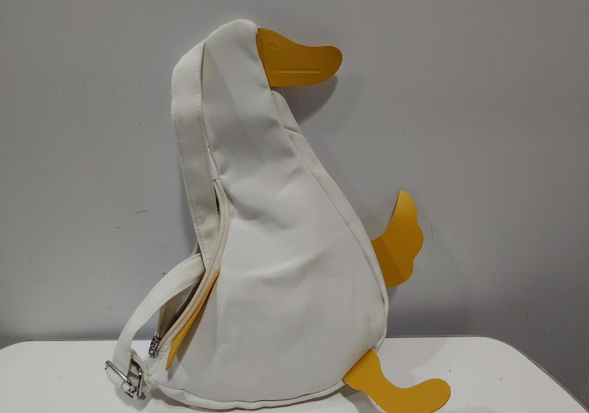 Off-white duck shaped crossbody bag with contrasting beak, wings and webbed feet, view 3
