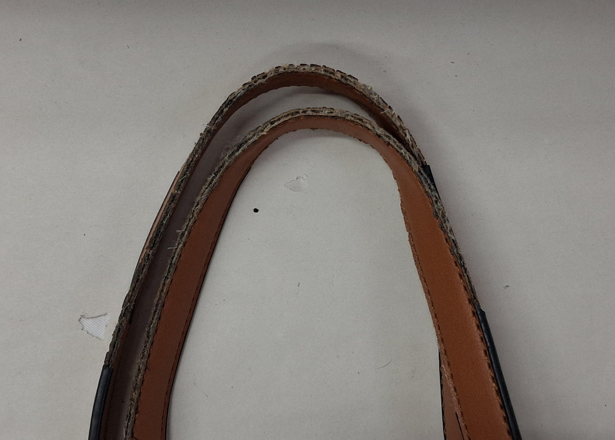 Black faux leather tote with brown handles and brown accent stitching, view 3