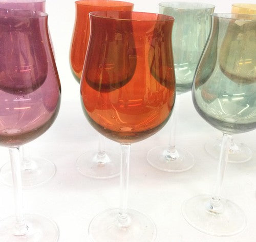 Eight long-stem wine glasses with green, orange, purple and red bowls and clear stems, view 3