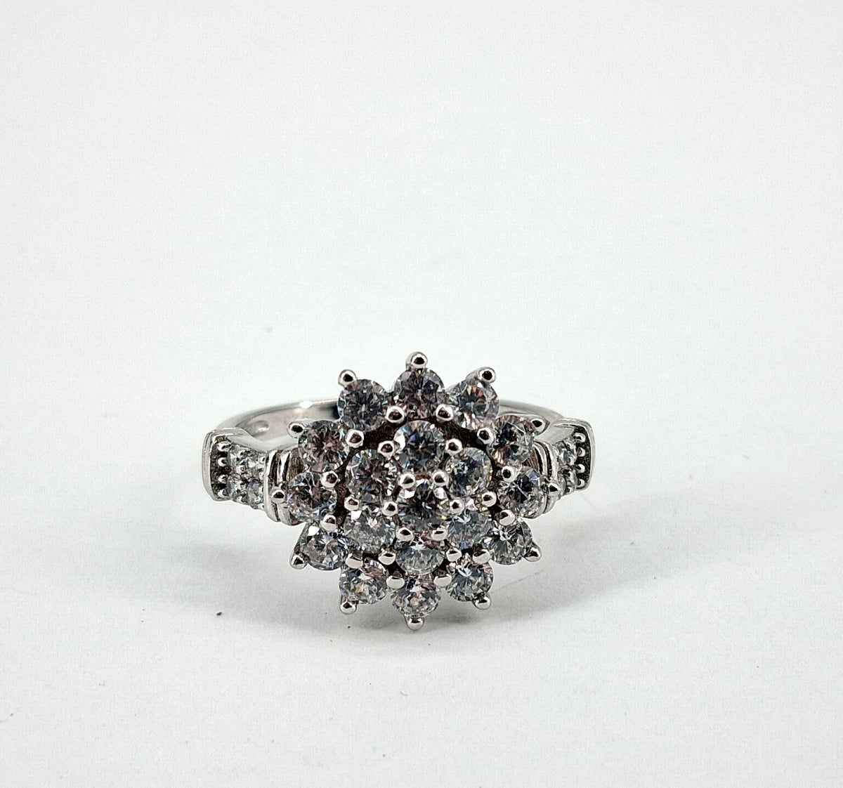 Silver cluster ring with starburst of round clear glass stones, view 2