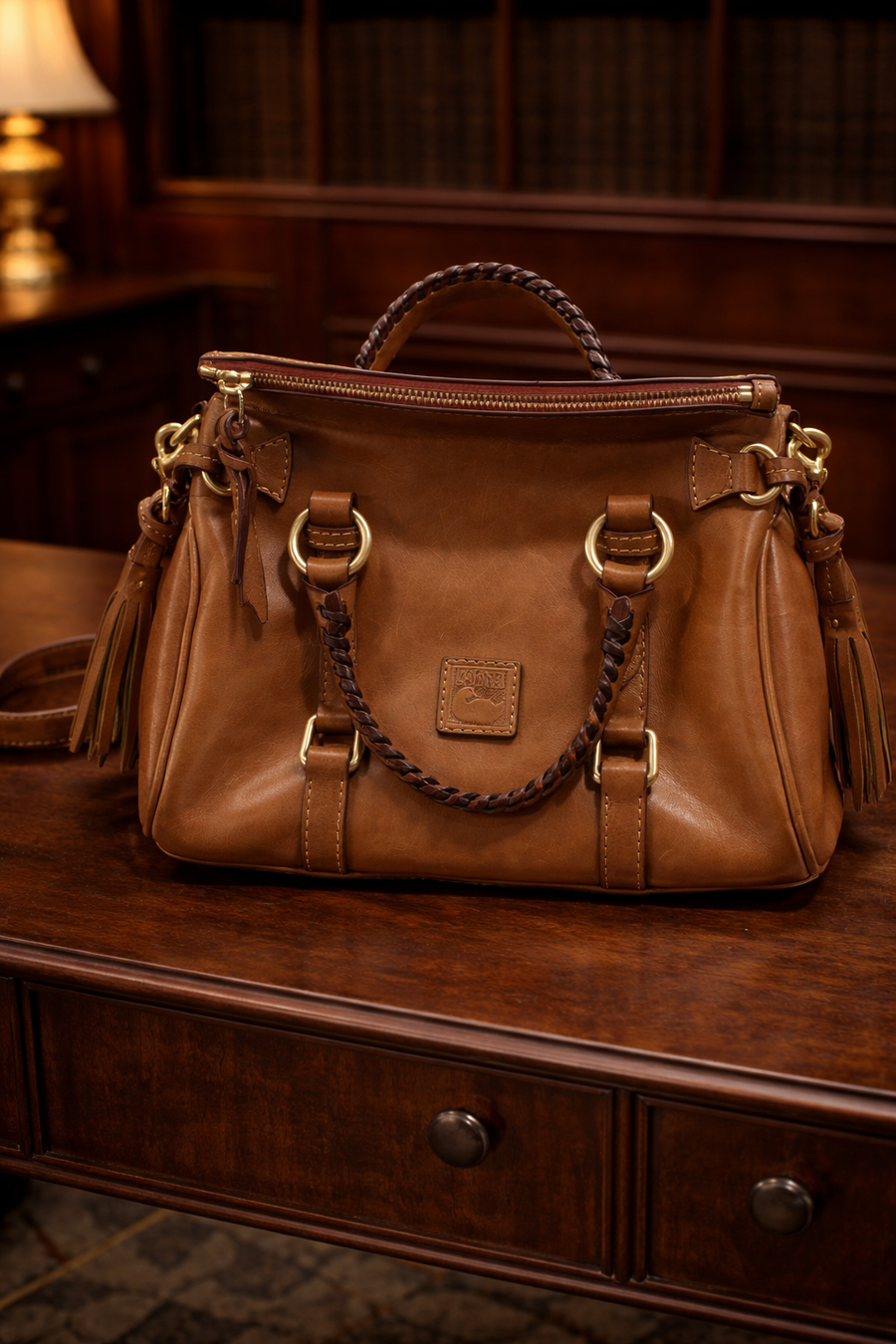 Dooney and Bourke brown Florentine leather satchel with tassels and braided handles