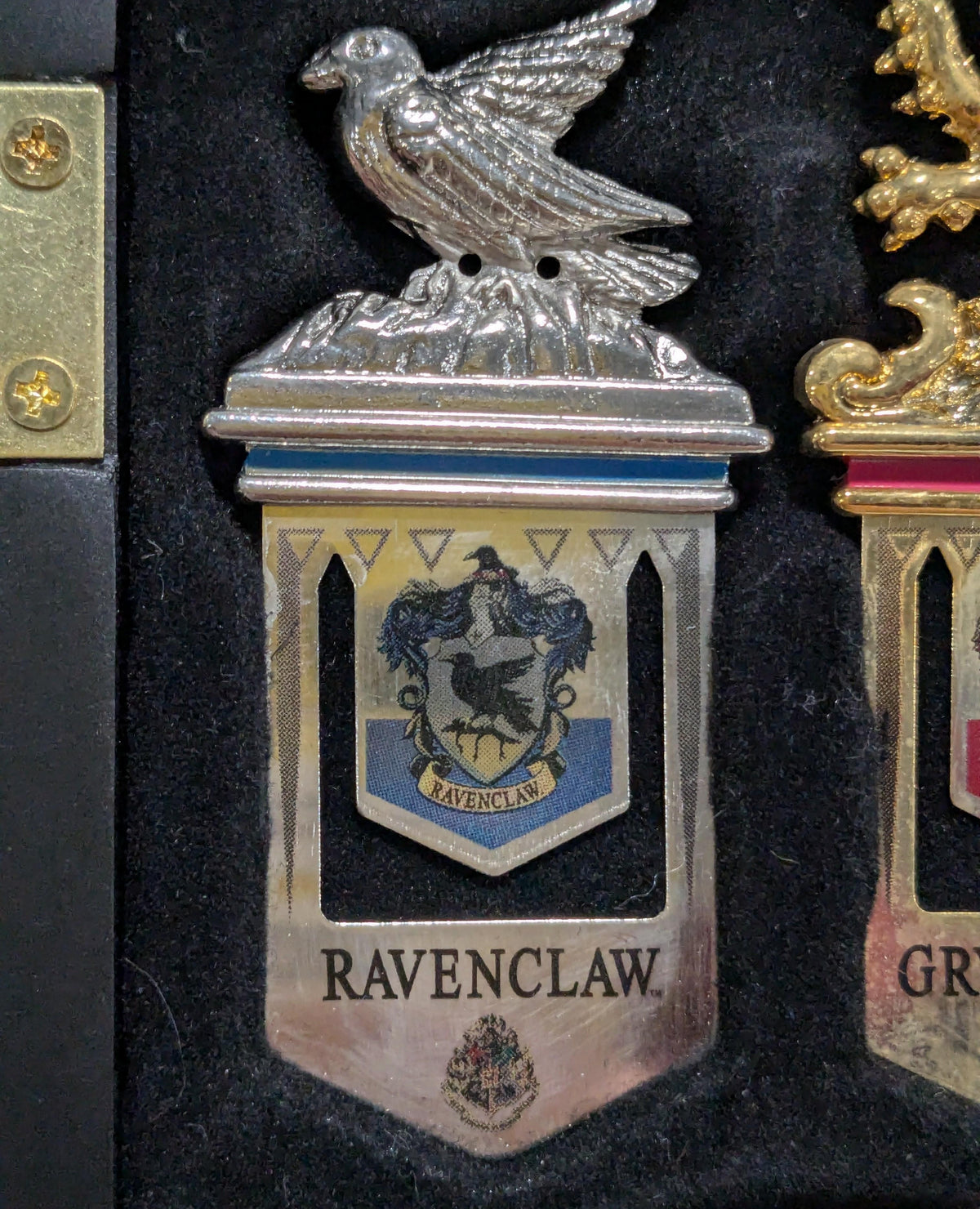 Four metal bookmarks with Hogwarts house crest designs, view 3