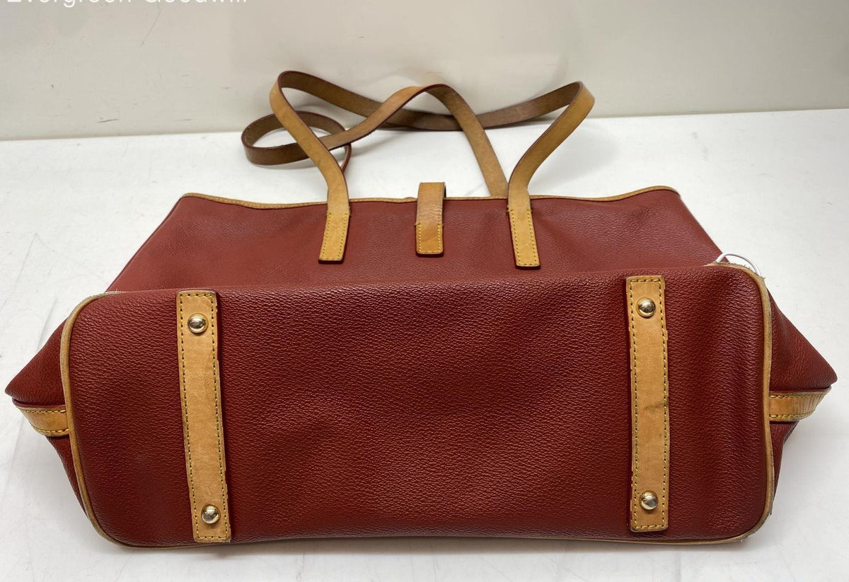 Dooney and Bourke red pebbled leather tote with tan trim, sold for repair or parts, view 2
