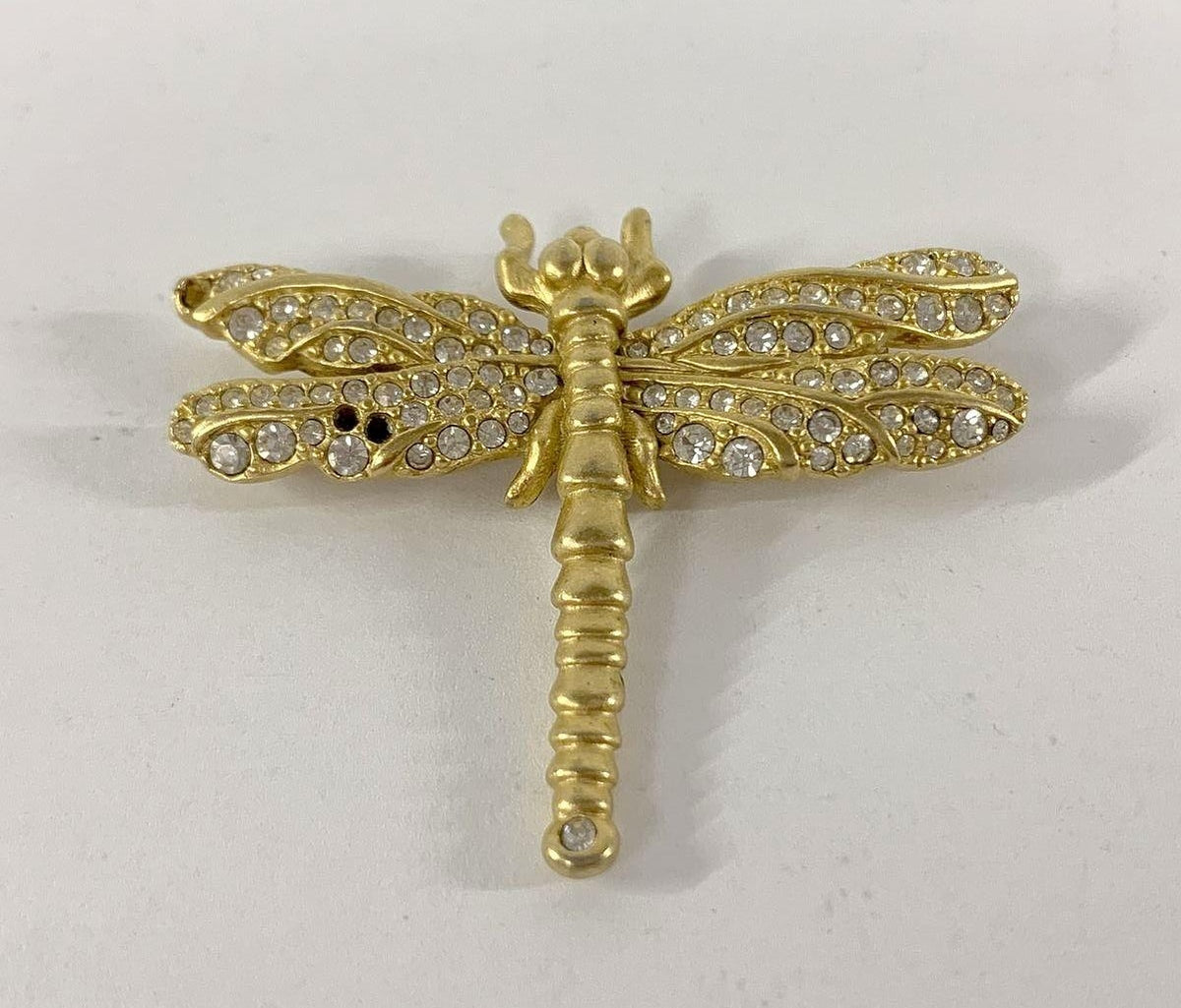 Gold-tone dragonfly brooch with clear crystals, several crystals missing from the wings, view 2