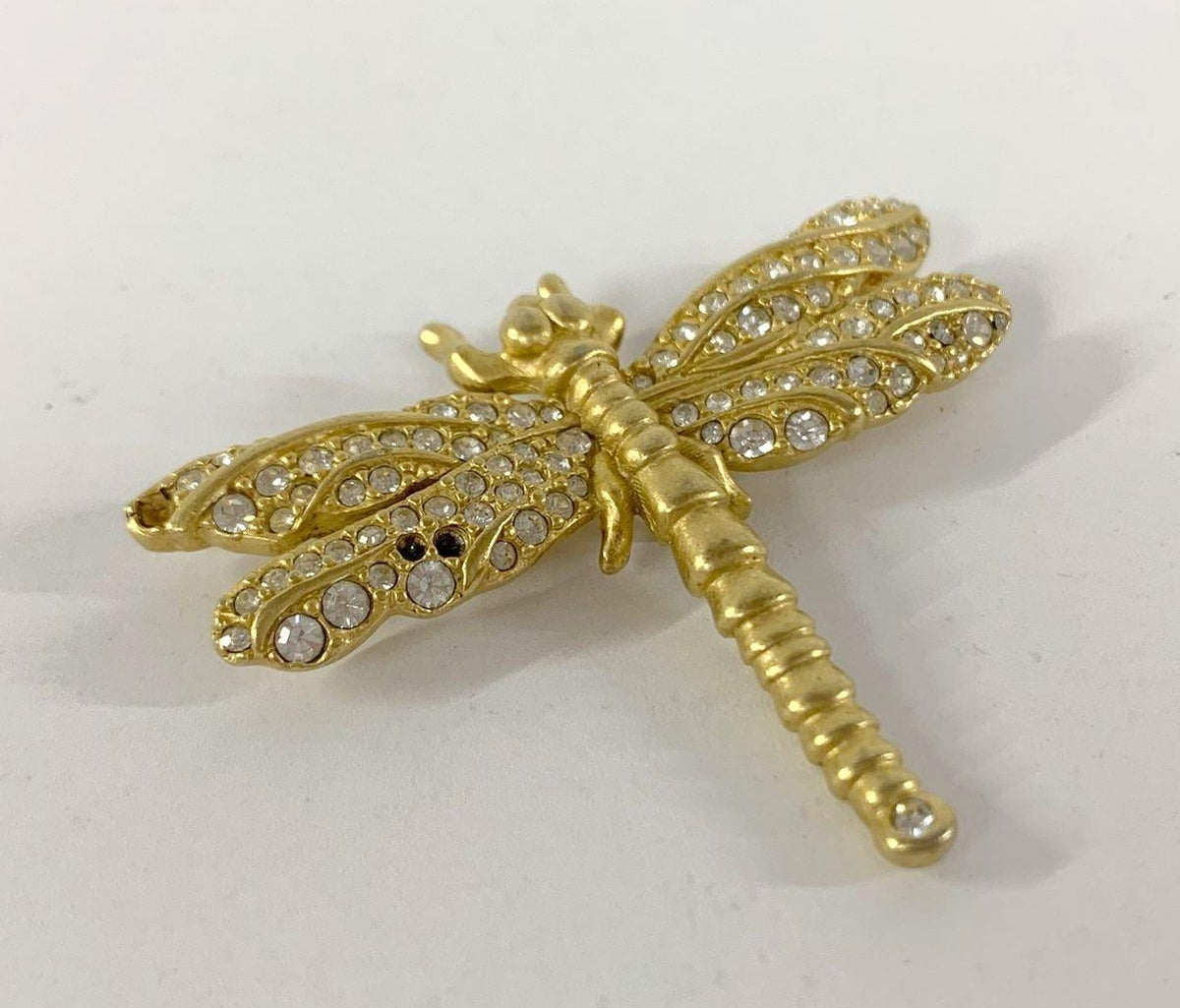 Gold-tone dragonfly brooch with clear crystals, several crystals missing from the wings, view 3