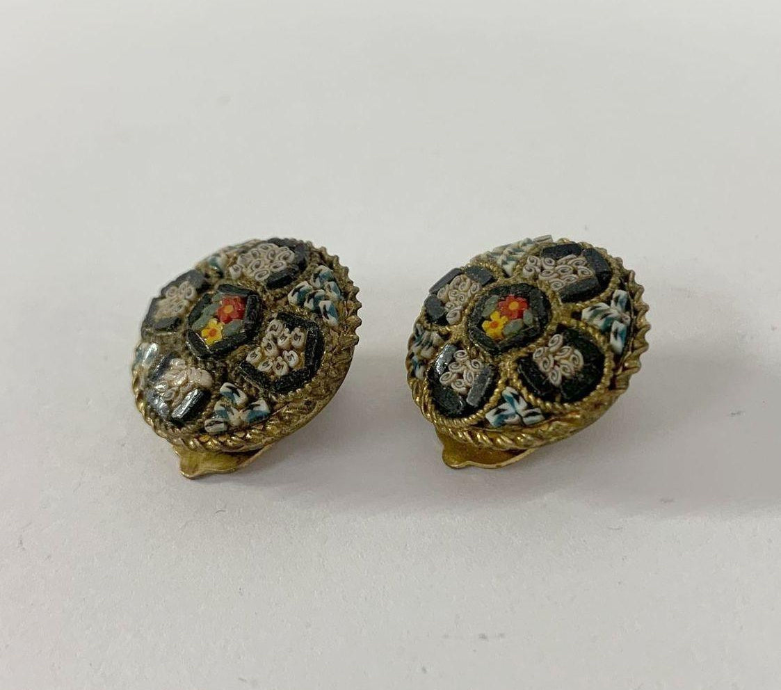 Round gold-tone clip-on earrings with mosaic glass flower and rope-twist border, view 3