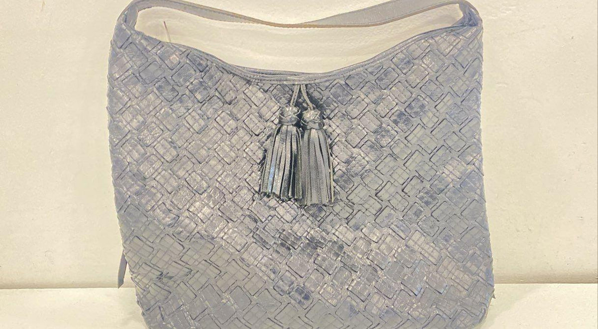 Lavender gray woven leather hobo bag with single top handle and front tassel accent, view 2