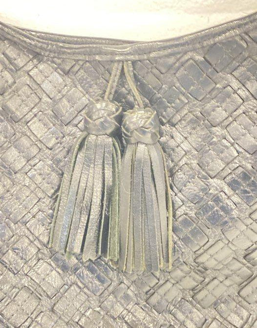 Lavender gray woven leather hobo bag with single top handle and front tassel accent, view 3