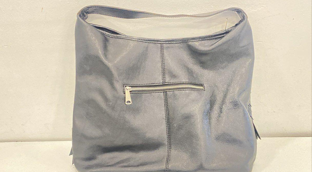 Lavender gray woven leather hobo bag with single top handle and front tassel accent, view 5