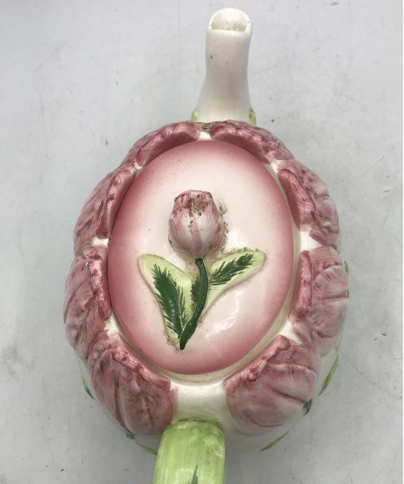 Pink tulip-shaped ceramic teapot with creamer and sugar bowl and green leaf accents, view 4