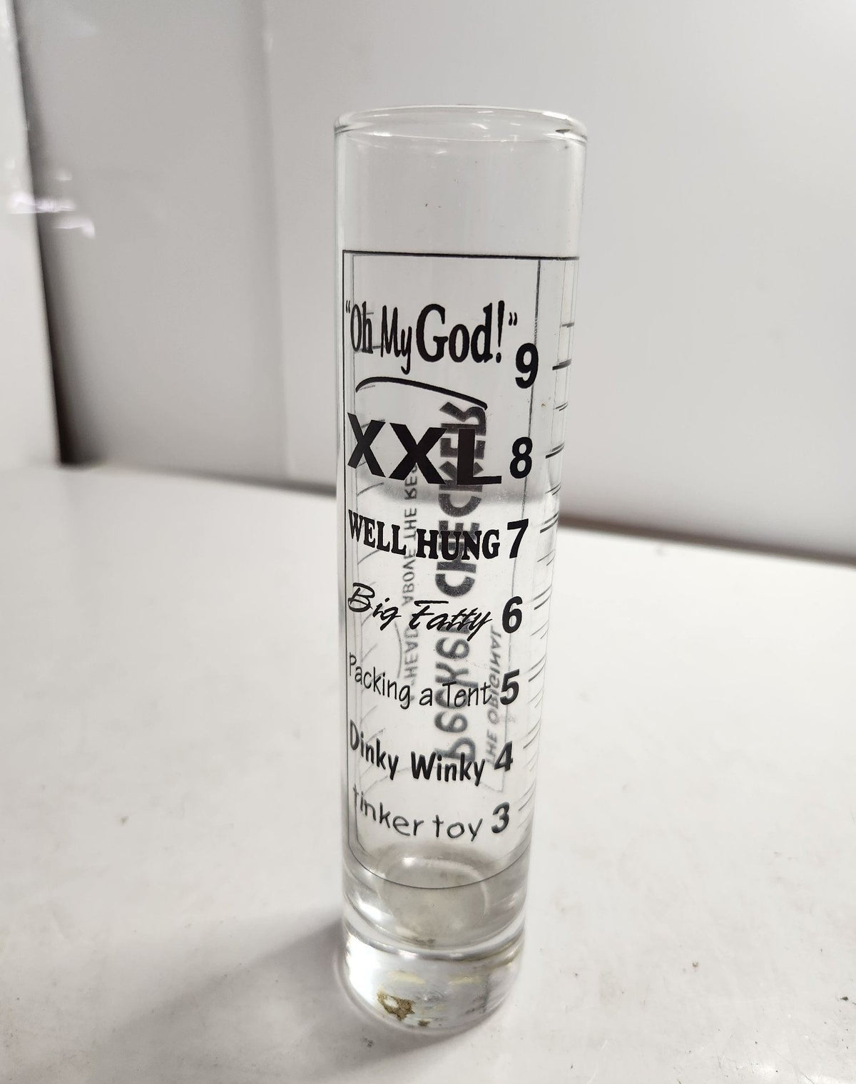 Tall clear novelty shot glass with black Original Pecker Checker printed graphic, view 4