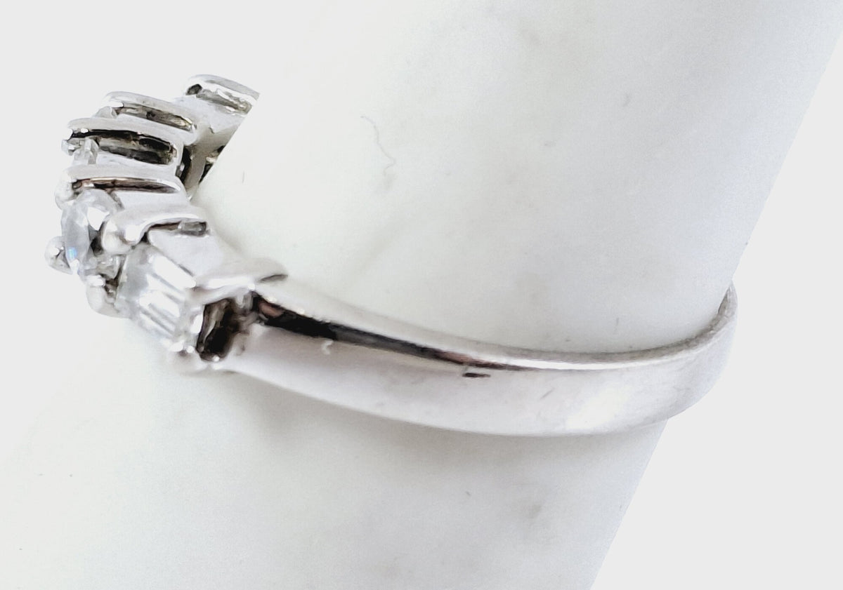 Silver-tone bridge-style ring with clear stones listed as cubic zirconia, size 6.5, view 5