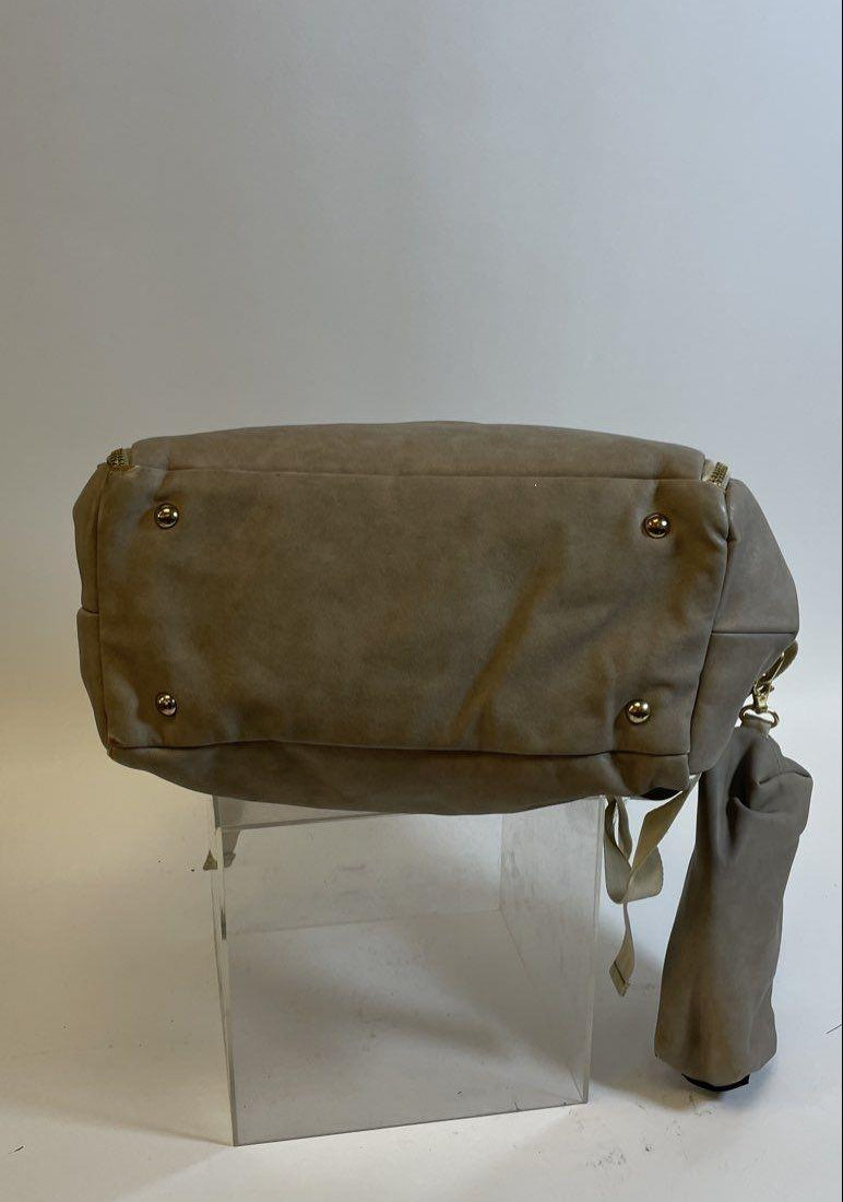 Petunia Pickle Bottom brown diaper bag with foldover flap and floral lining, view 9