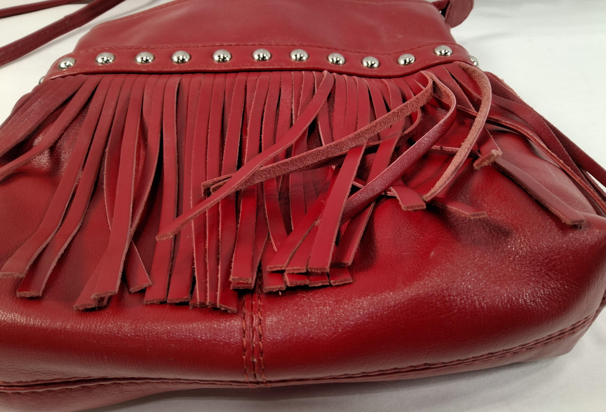 Red leather crossbody bag with front fringe and silver-tone studs, view 4