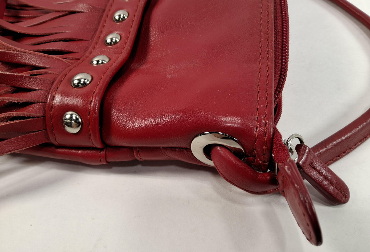 Red leather crossbody bag with front fringe and silver-tone studs, view 5