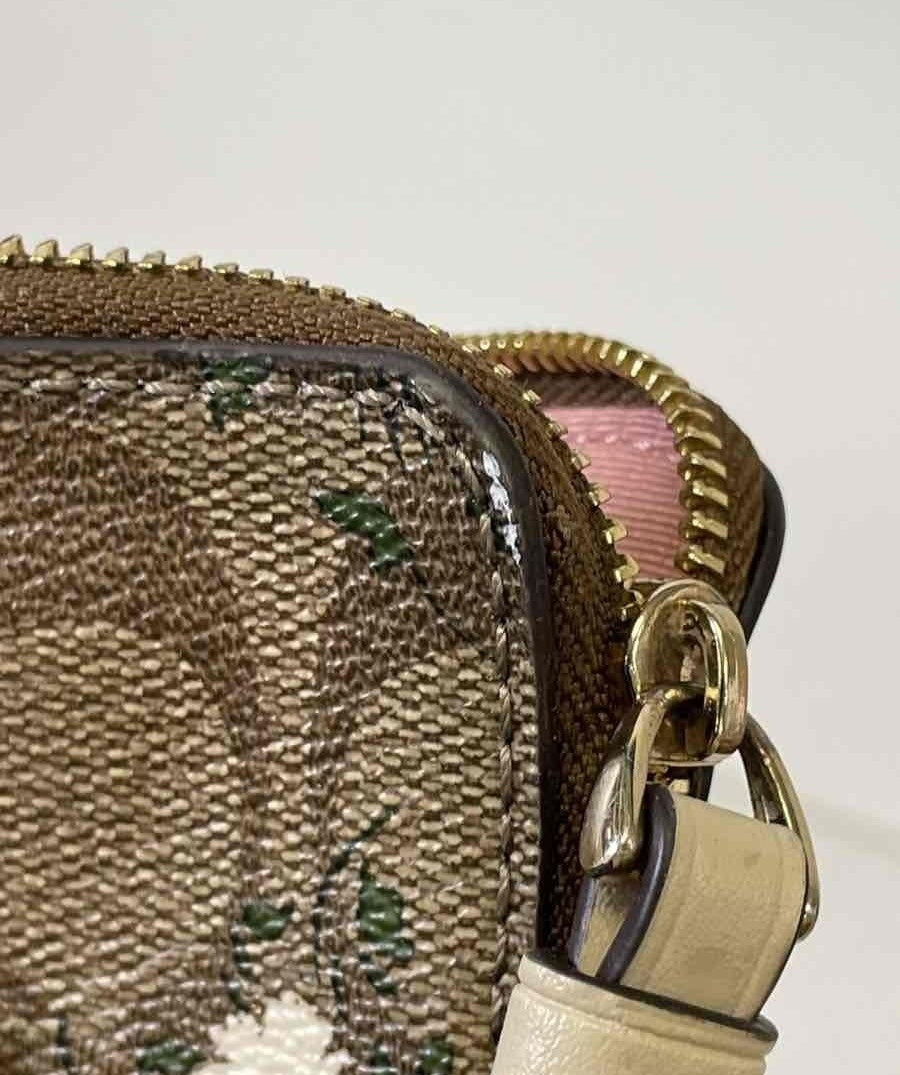 Brown signature jacquard wristlet with small floral print, zip top and wrist strap, view 6
