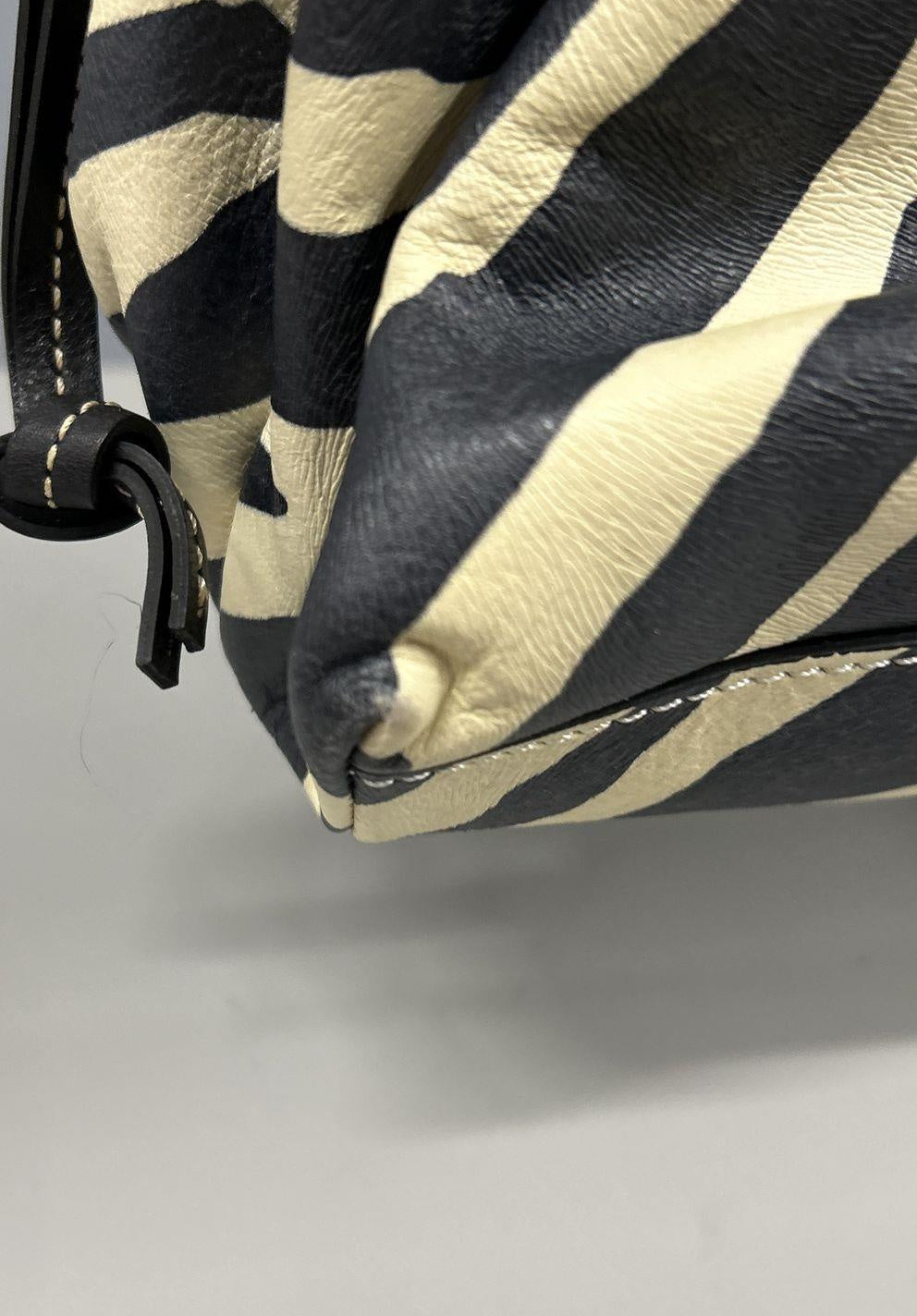 Dooney & Bourke black and white zebra print satchel with black leather trim and silver-tone logo plate, view 6