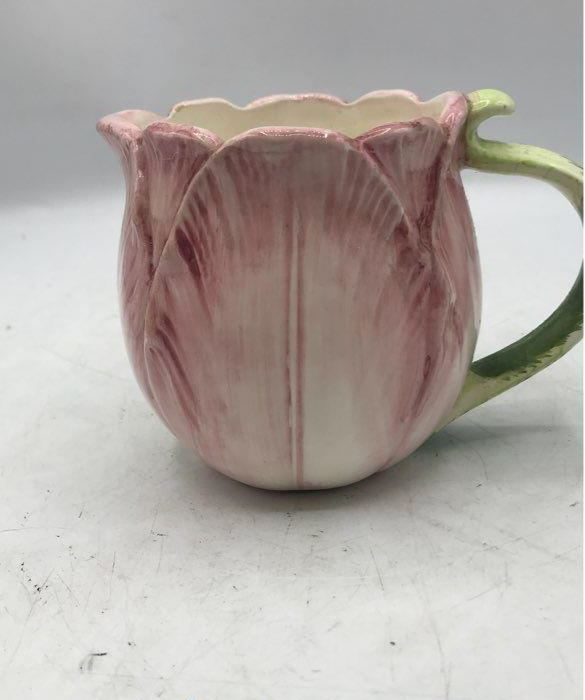 Pink tulip-shaped ceramic teapot with creamer and sugar bowl and green leaf accents, view 5