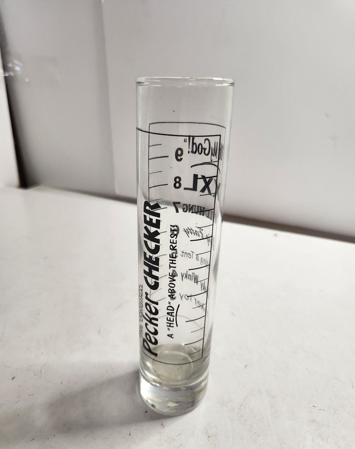 Tall clear novelty shot glass with black Original Pecker Checker printed graphic, view 5
