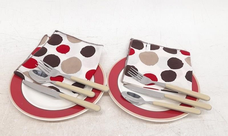 Black picnic cooler tote with red, white and black picnic service pieces, view 4