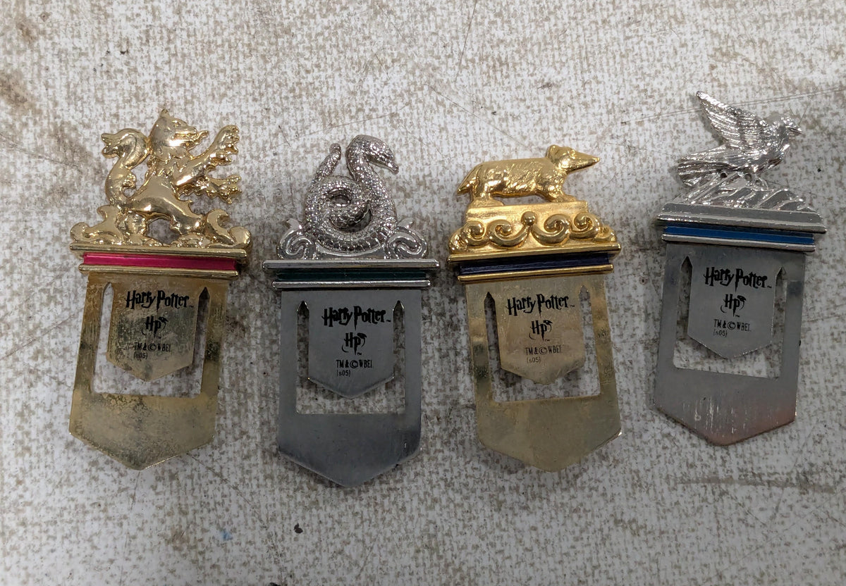 Four metal bookmarks with Hogwarts house crest designs, view 6