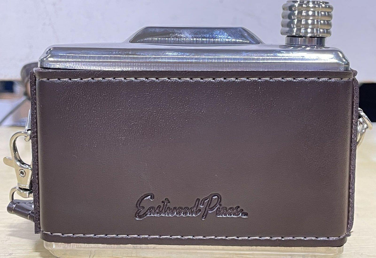 Brown and silver-tone camera-shaped stainless steel hip flask with strap, funnel and box, view 3