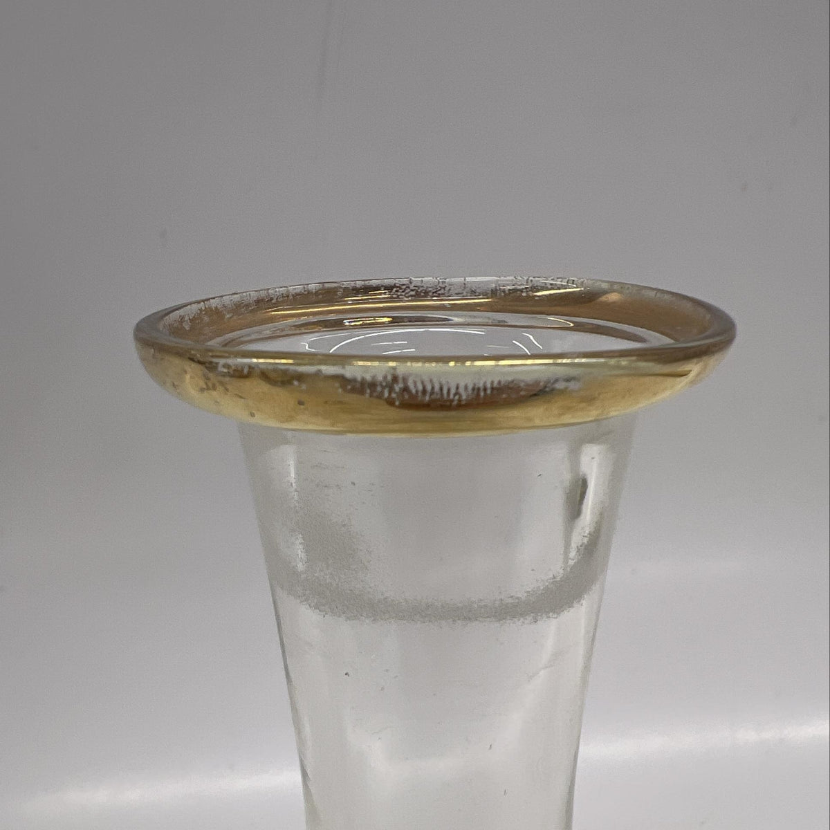 Clear glass decanter with gold accent bands and matching stopper, view 2