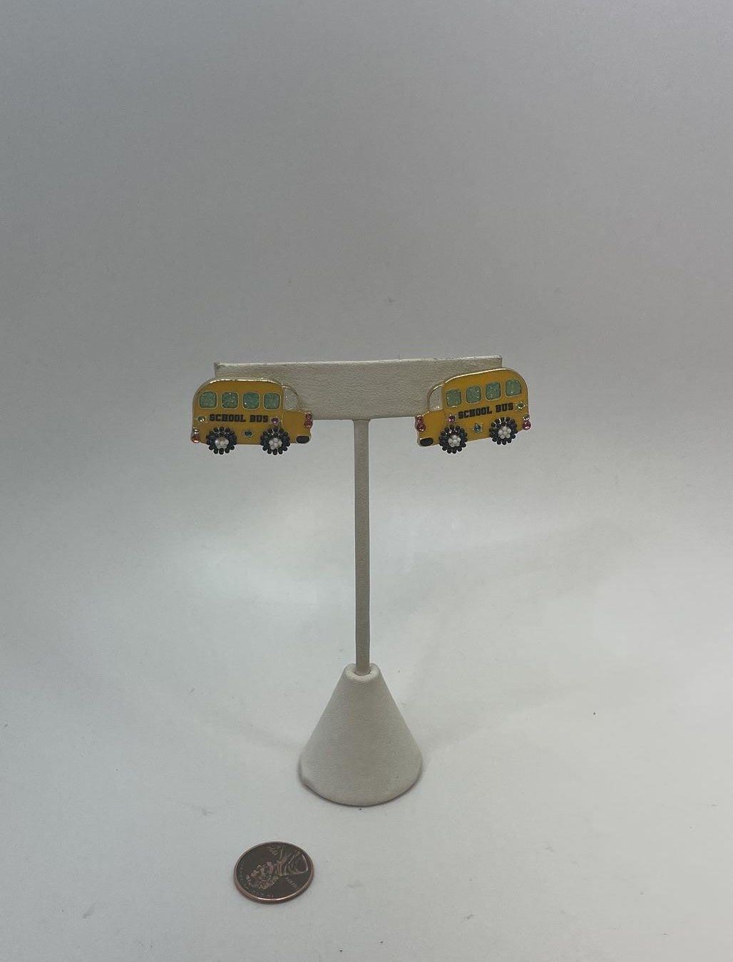 Yellow enamel school bus stud earrings with black and white details, view 3
