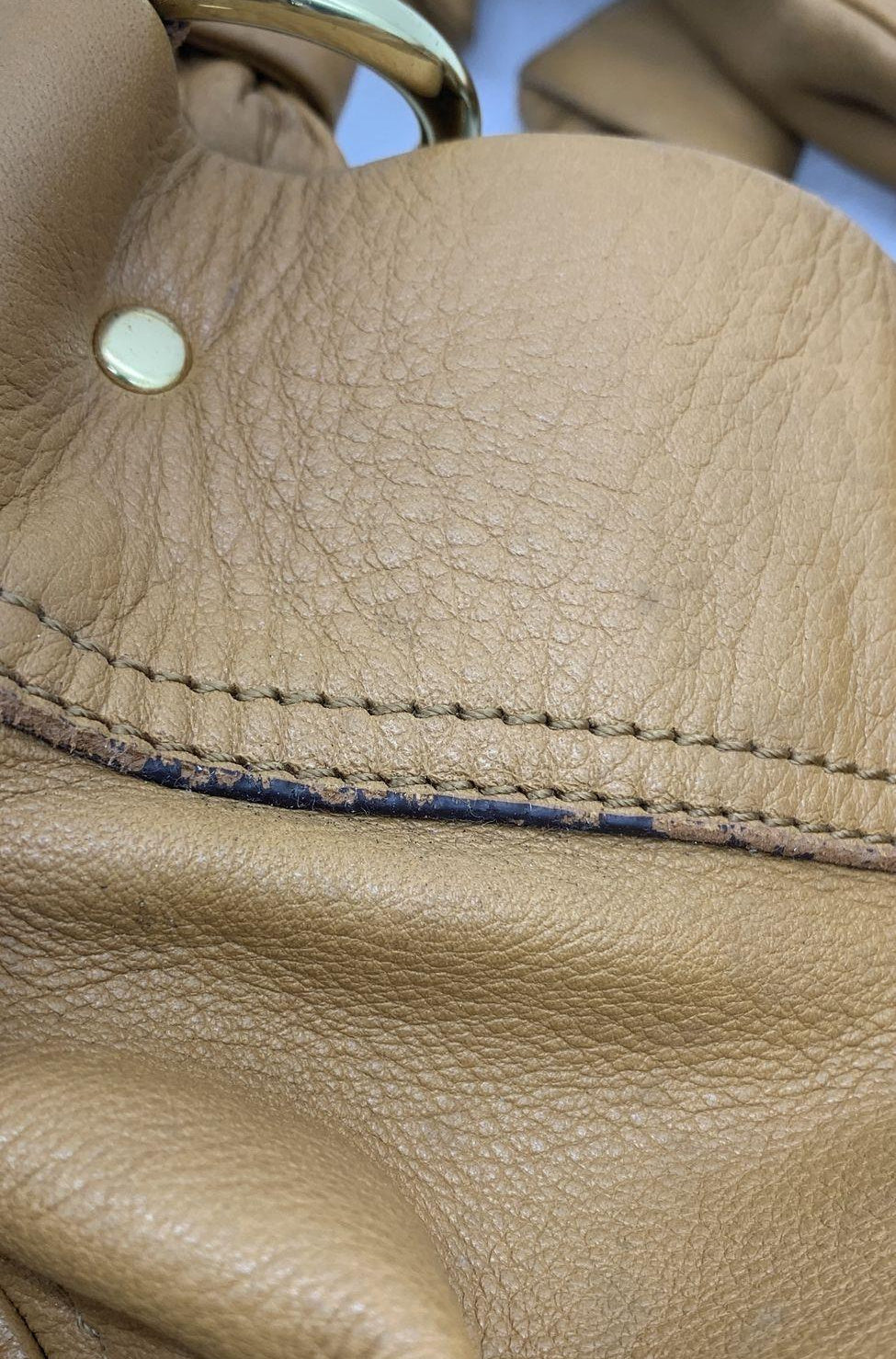 Tan leather hobo shoulder bag with gathered body and dual shoulder straps, view 10