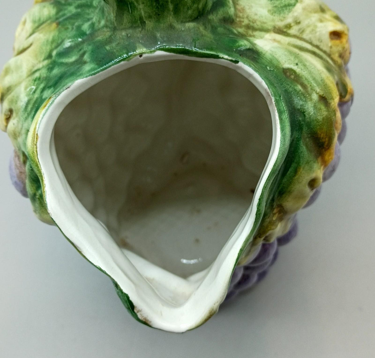 Bassano Italy purple grape cluster ceramic pitcher with green leaves and brown vine handle, view 3