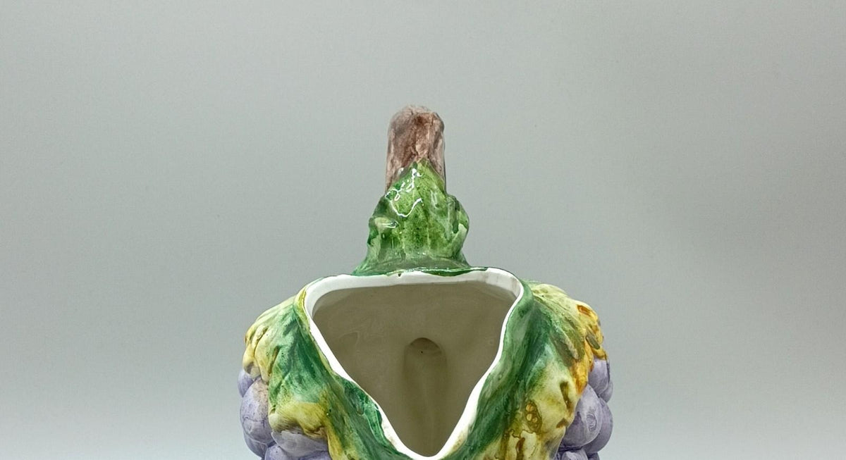 Bassano Italy purple grape cluster ceramic pitcher with green leaves and brown vine handle, view 4