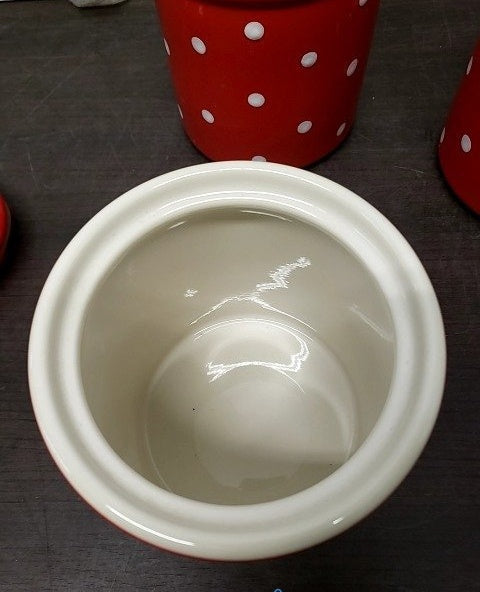 Three graduated red ceramic canisters with white polka dots and lids, view 7