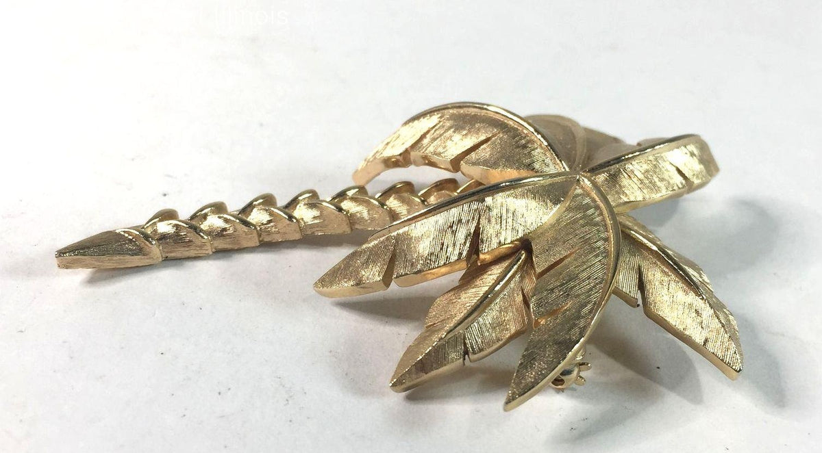 Gold-tone palm tree brooch with textured fronds and curved trunk, view 2