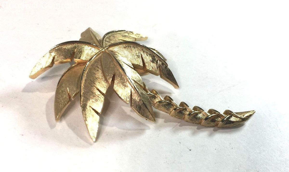 Gold-tone palm tree brooch with textured fronds and curved trunk, view 3