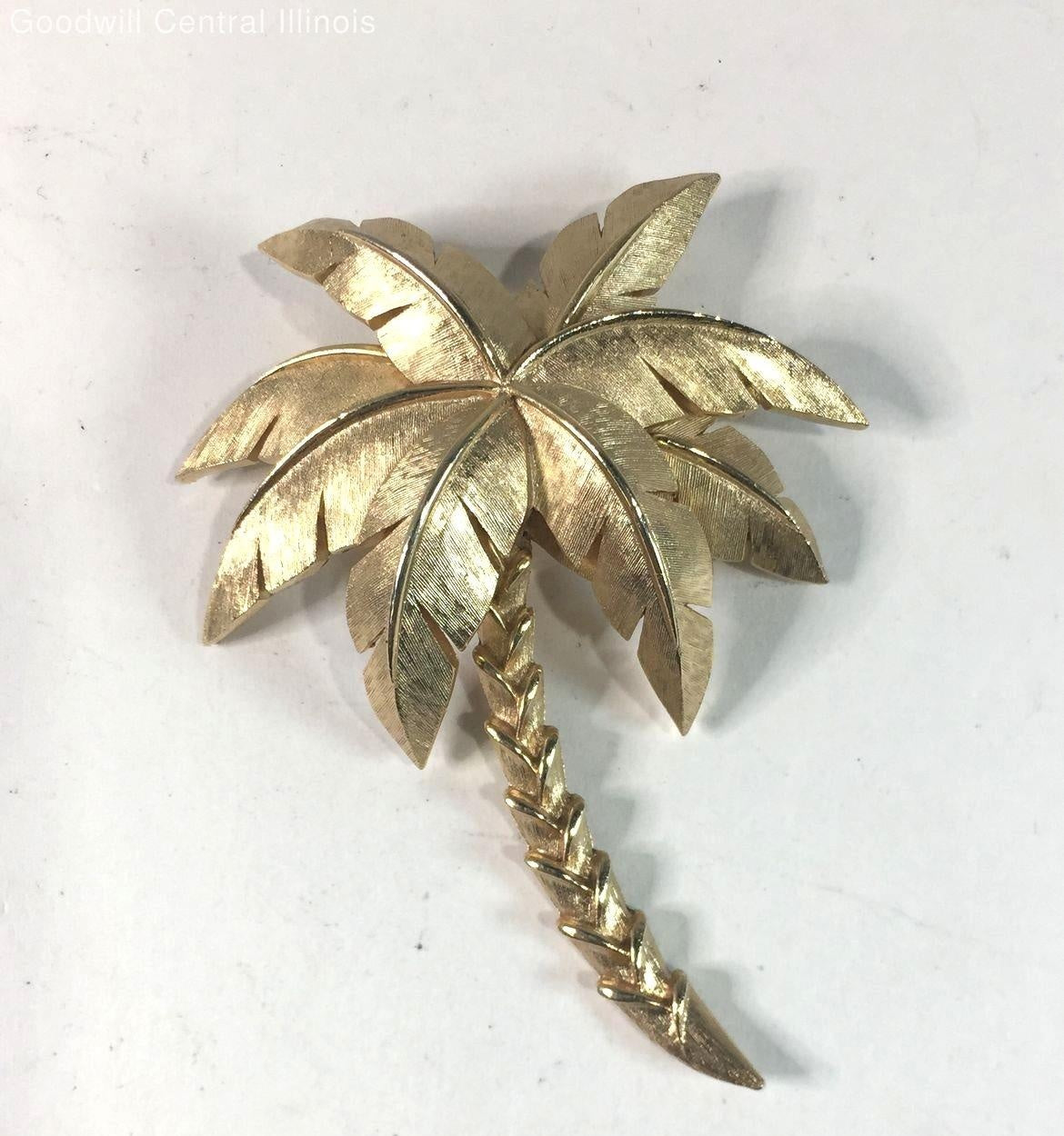 Gold-tone palm tree brooch with textured fronds and curved trunk, view 4