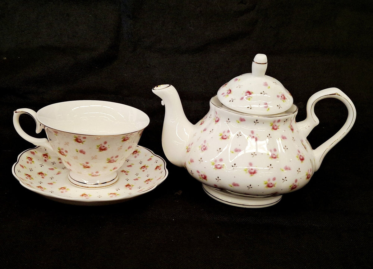 Small ivory porcelain floral tea set with teapot, cups, saucers and original box, view 3