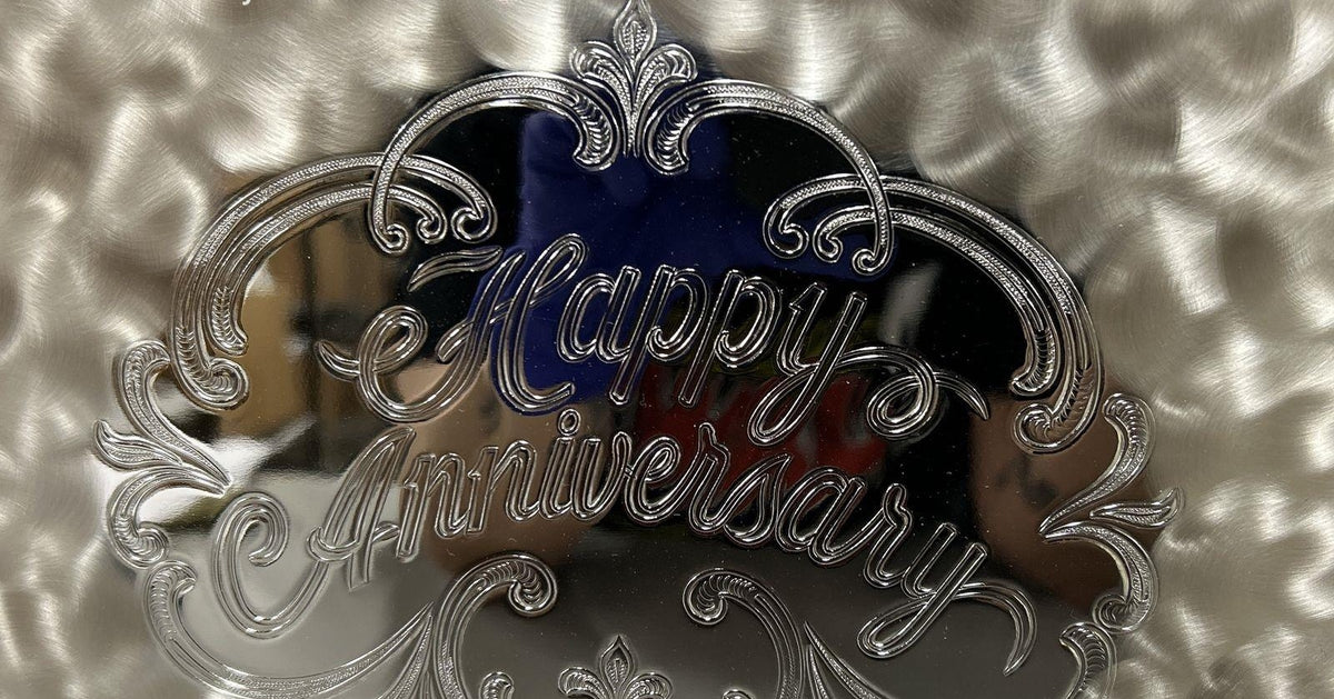 Silver-colored WMF Ikora scalloped serving plate with hammered center and raised Happy Anniversary, view 3