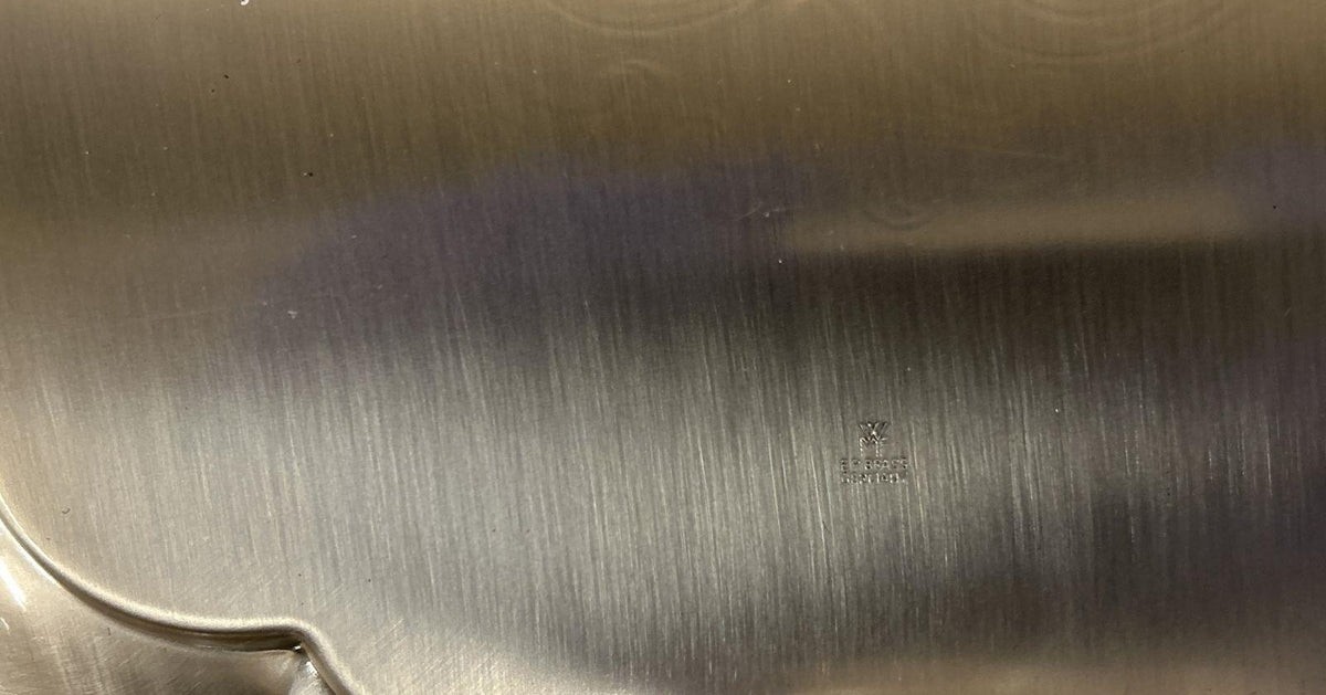 Silver-colored WMF Ikora scalloped serving plate with hammered center and raised Happy Anniversary, view 5