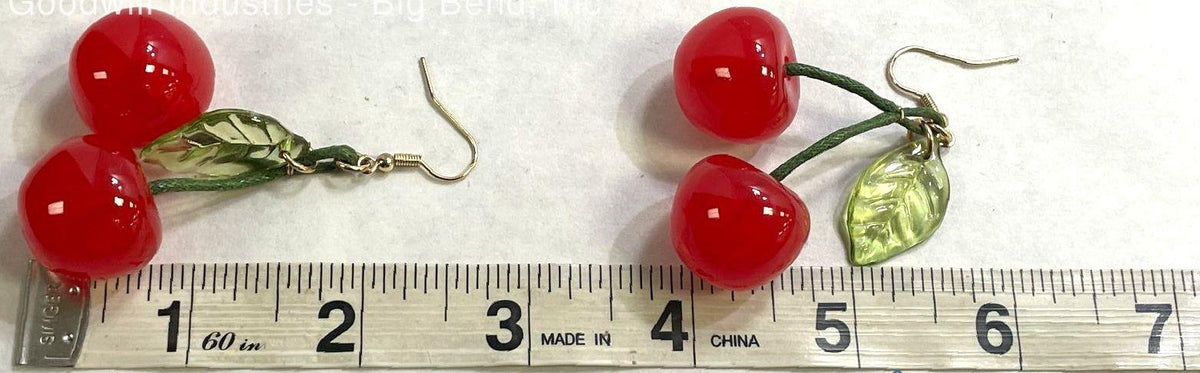 Red cherry dangle earrings with green leaf detail on gold-tone hooks, view 2