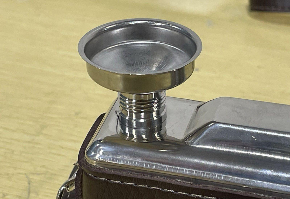Brown and silver-tone camera-shaped stainless steel hip flask with strap, funnel and box, view 7