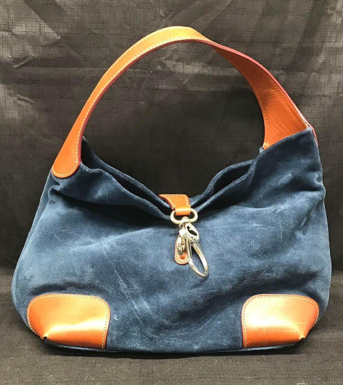 Dooney and Bourke navy blue suede shoulder purse with cognac brown leather trim and duck logo charm, view 2