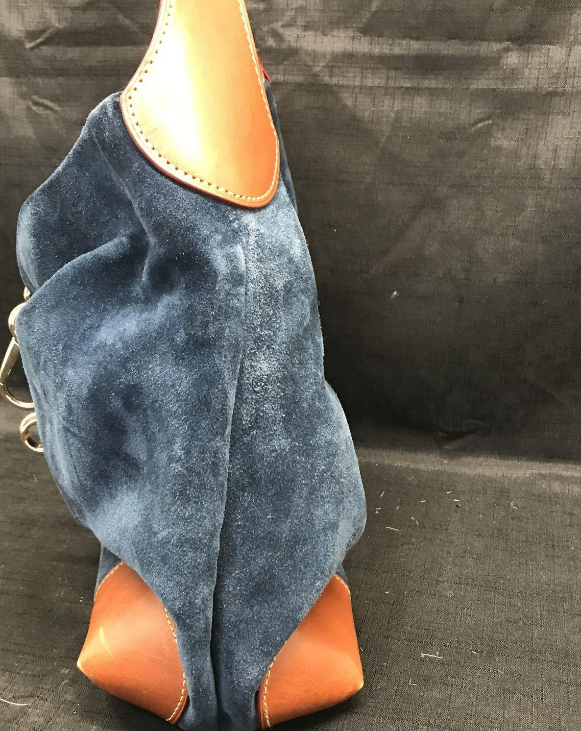 Dooney and Bourke navy blue suede shoulder purse with cognac brown leather trim and duck logo charm, view 5