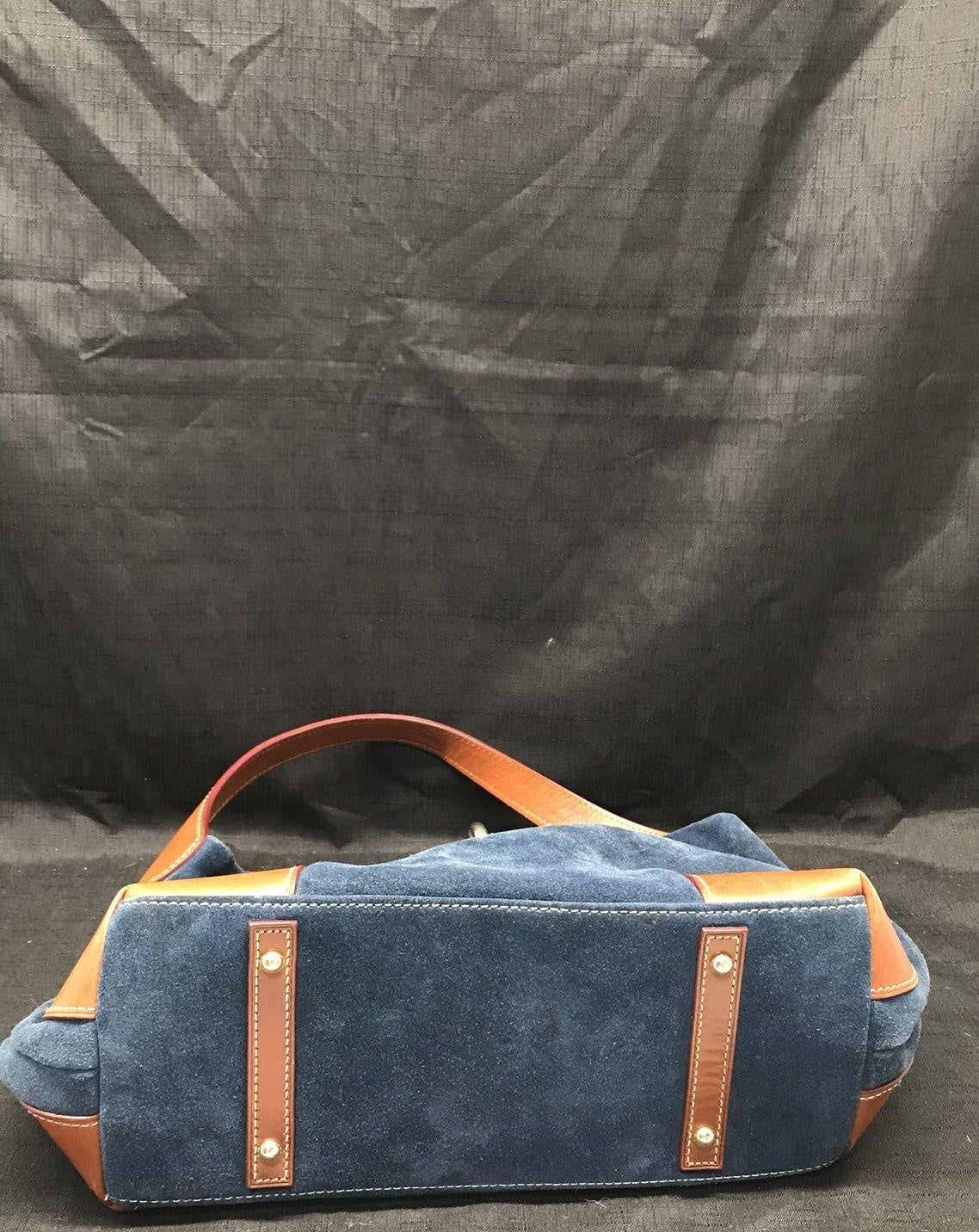 Dooney and Bourke navy blue suede shoulder purse with cognac brown leather trim and duck logo charm, view 6