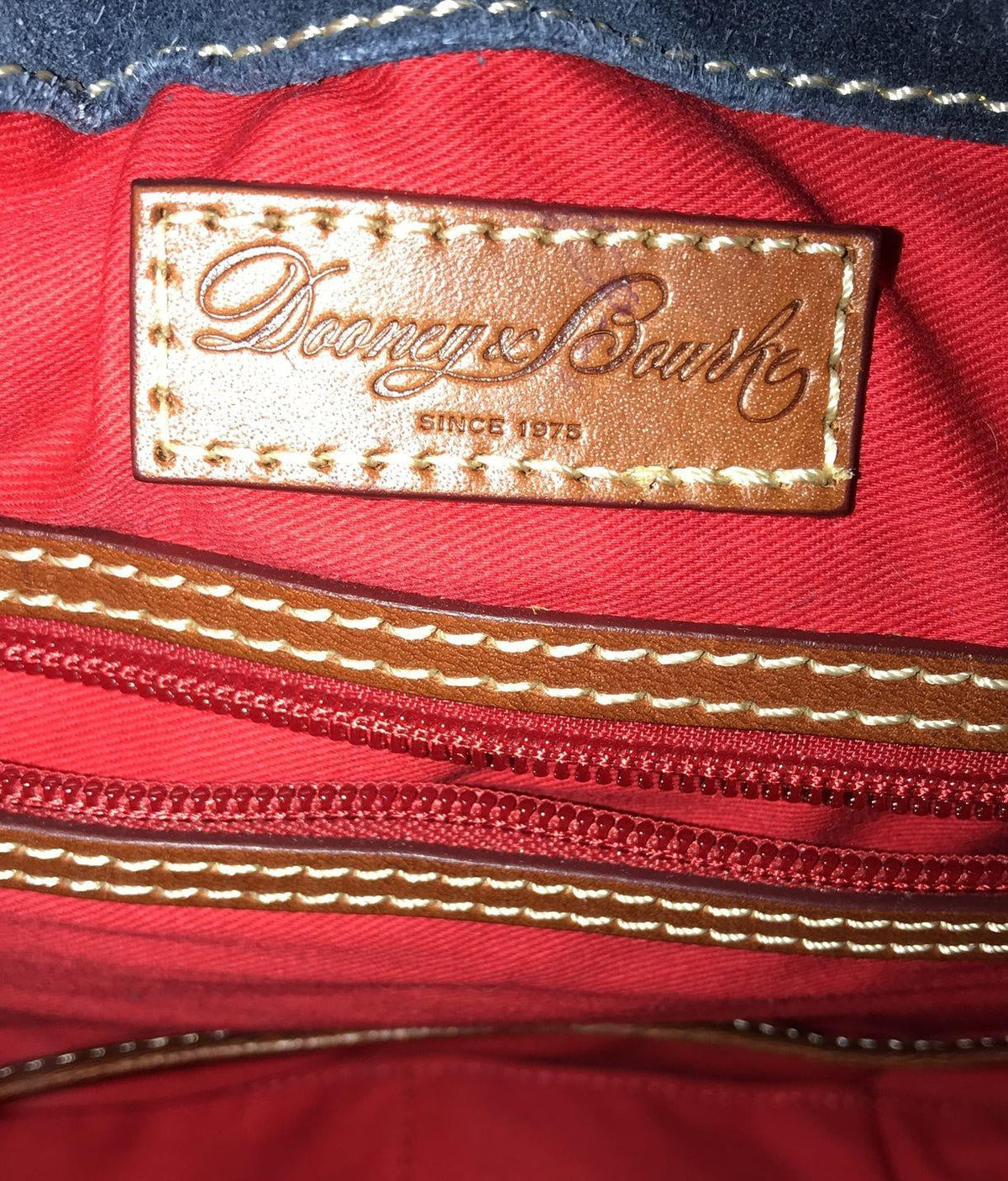 Dooney and Bourke navy blue suede shoulder purse with cognac brown leather trim and duck logo charm, view 8