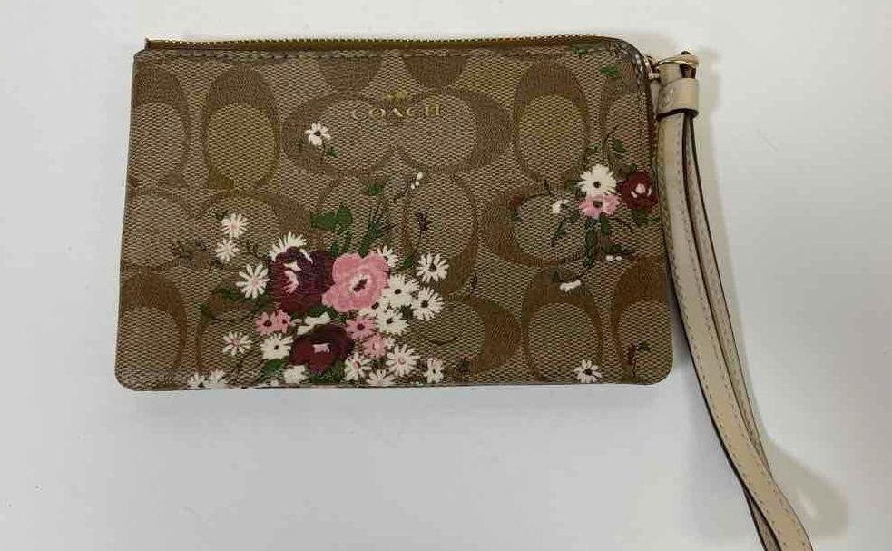 Brown signature jacquard wristlet with small floral print, zip top and wrist strap, view 2