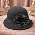 Black felt cloche hat with layered flower accent