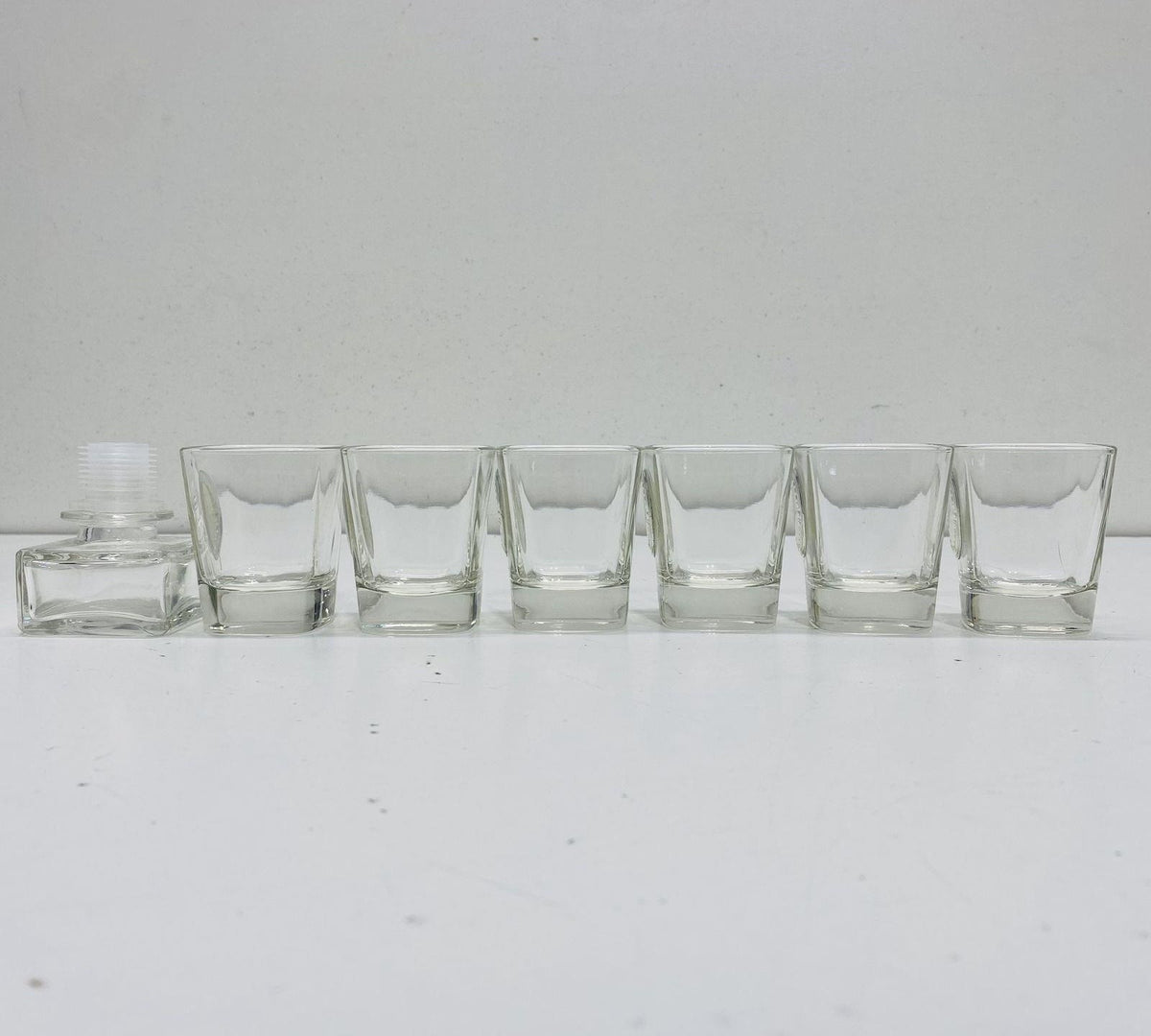 Faceted clear glass decanter with oval label detail, six shot glasses and white gift box, view 2