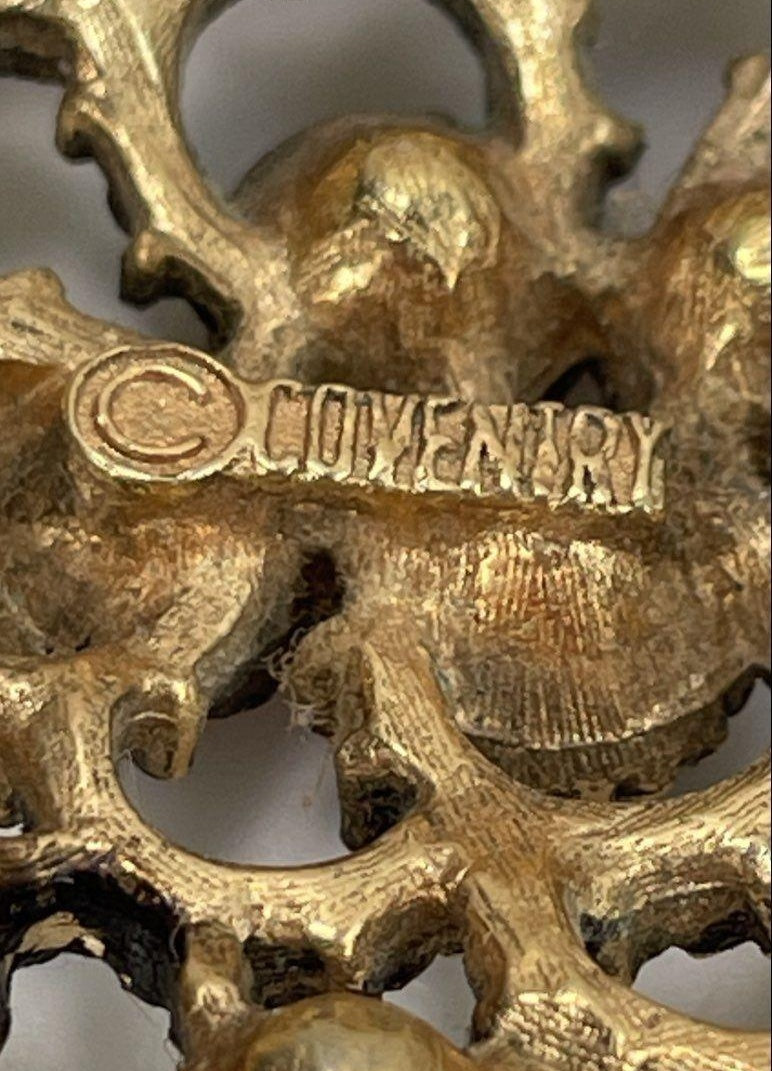 Sarah Coventry gold-tone filigree diamond-shaped brooch with pink and green glass stones, view 4