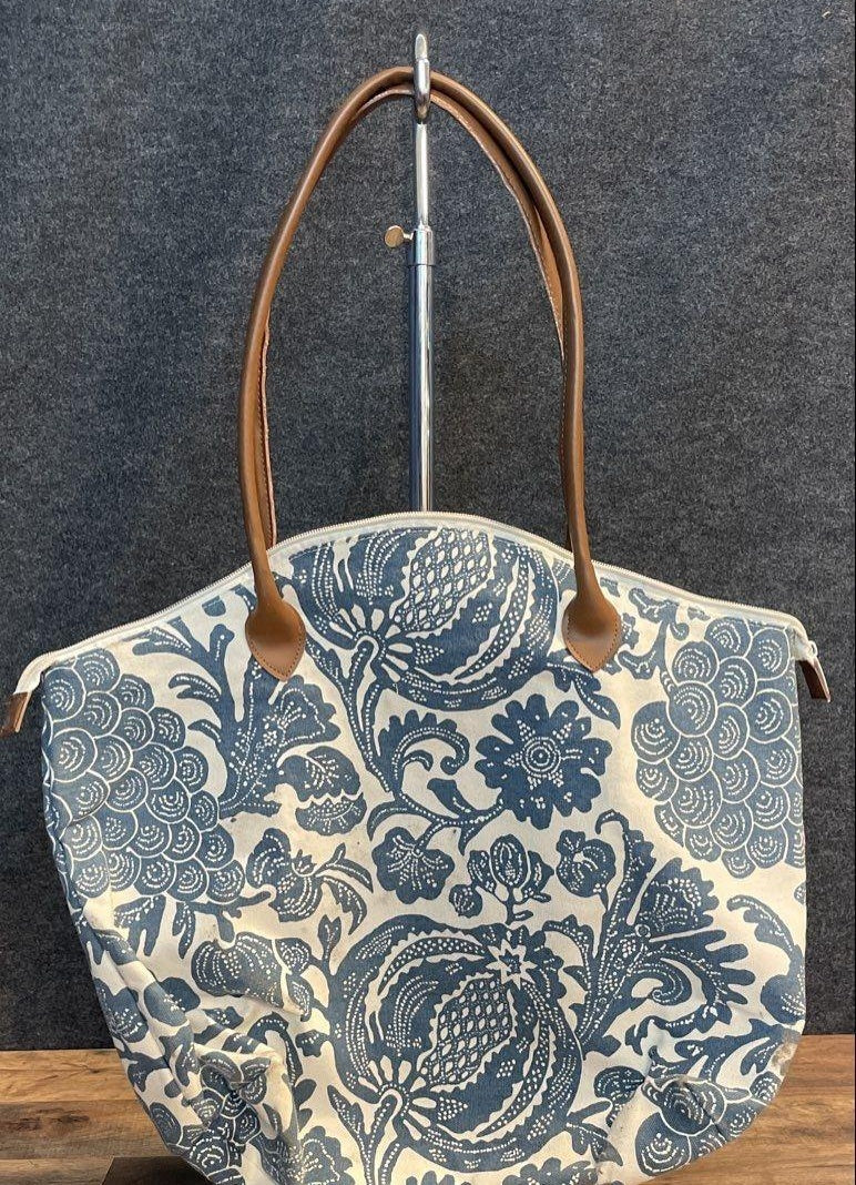 Blue and white floral canvas tote with tan handles and matching pouch, view 7